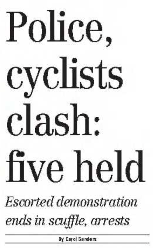 A screenshot of a newspaper headline attributed to Carol Sanders “Police, cyclists clash: five held”, subhead “Escorted demonstration ends in scuffle, arrests”